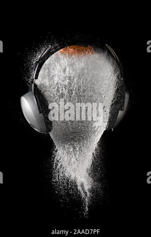 Representation of the explosion of a head with headphones Stock Photo
