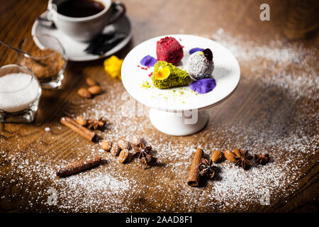 Vegan truffles dessert served on a plate in restaurant Stock Photo