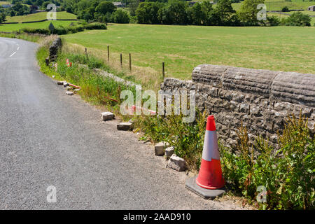 A collapsed wall at the side of the road in the Yorkshire Dales National Park, England. Stock Photo