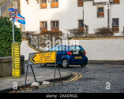 Leith, Edinburgh, Scotland, United Kingdom. 21st Nov, 2019. Trams to Newhaven work starts: streets closed to traffic for the next 2-3 years to build the extension for Edinburgh's tram line to Newhaven, with 8 more stops over 2.91 miles. Diversions have caused problems with traffic in the narrow lanes. The work is being undertaken by SFN (Sacyr Farrans Neopul) and MUS (Morrison Utility Services). A diversion on Water Street for HGV traffic to avoid narrow cobbled lanes in Leith Stock Photo