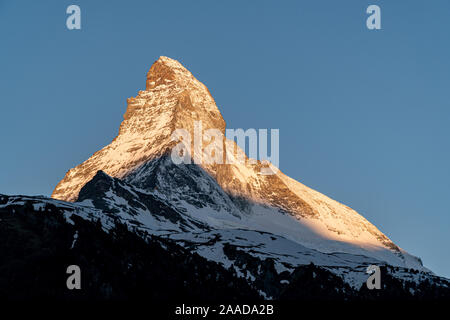 East and north faces of the Matterhorn during sunrise in Zermatt, Switzerland during spring time.