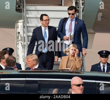 U.S. Treasury Secretary Steve Mnuchin, (left), along with presidential advisers Jared Kushner (right) and Ivanka Trump (front)--also President Donald Trump's son-in-law and daughter--arrive with Pres. Trump at Austin Bergstrom International Airport to tour an Apple assembly plant in north Austin. Stock Photo