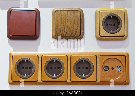 modern electrical outlets and switches on the wall Stock Photo