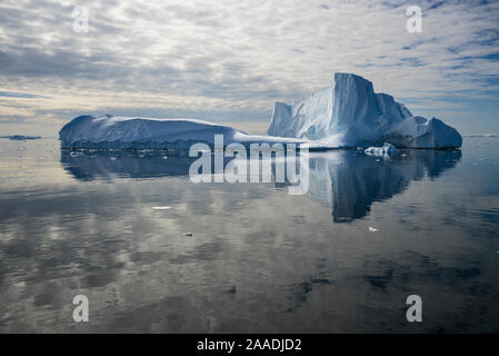 Iceberg reflected in still water of the Crystal Sound, near Detaille Island, Antarctic Peninsula, Antarctica  January 2017. Photographed for The Freshwater Project Stock Photo