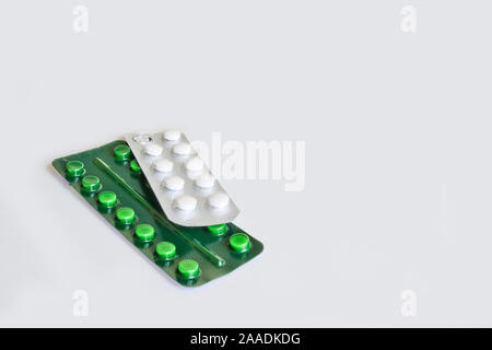 Pills in blister packs on a light background. Medicines for diseases. Stock Photo