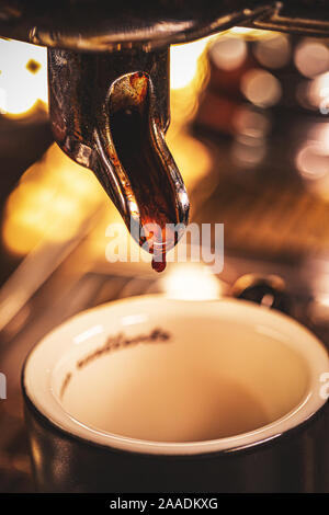Close-up of espresso pouring from coffee machine Stock Photo
