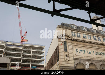 An urban landscape of the Port of London's businesses in the former Smithfield meat market, on 20th November 2019, at Smithfield in the City of London, England. There has been a market on this location since the Bartholomew Fair was established in 1133 by Augustinian friars. Stock Photo