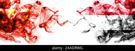 China, Chinese vs Yemen, Yemeni smoky mystic states flags placed side by side. Concept and idea thick colored silky abstract smoke flags Stock Photo