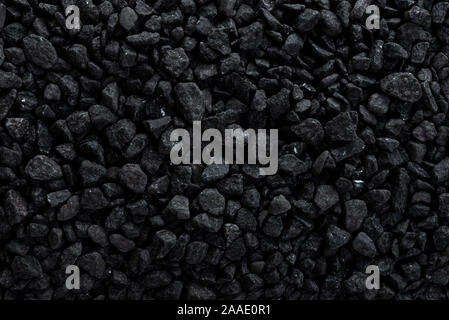 Black road stones gravel texture. Rocks for construction, dark background of crushed granite gravel, small rocks, wallpaper Stock Photo