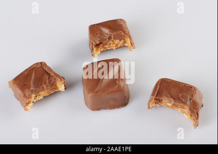 Candy bars with bites isolated on white background Stock Photo