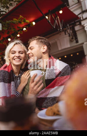 Cheerful couple enjoying their date drinking coffee Stock Photo