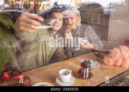Couple taking a selfie during their date Stock Photo