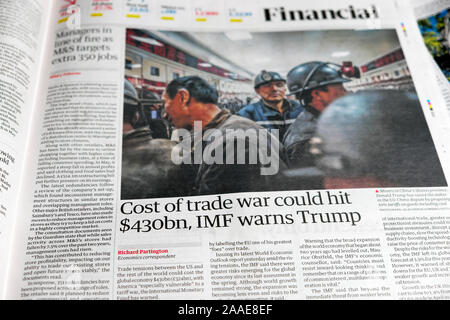 'Cost of trade war could hit $430bn, IMF warns Trump' newspaper headline article in Financial section of the Guardian newspaper London UK Stock Photo