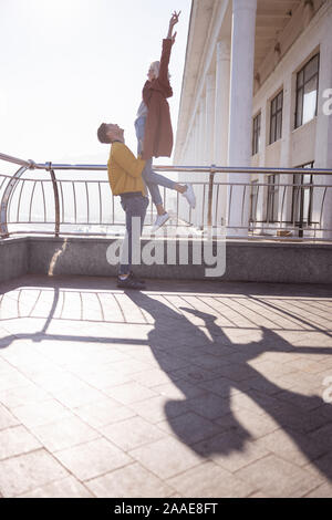 Beautiful woman feeling wonderful during her morning date Stock Photo