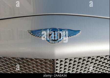 Close up of Bentley badge on the bonnet of a Bentley Continental luxury motor car. Stock Photo
