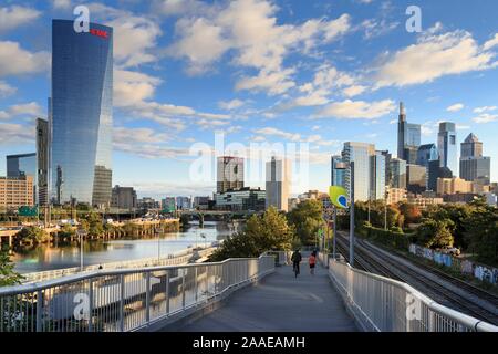 Philadelphia Skyline with Schuylkill River Park Boardwalk in Autumn with Bikers and Joggers, Philadelphia, Pennsylvania, USA Stock Photo