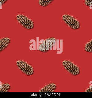 Christmas seamless pattern with fir cones on red background. Christmas abstract background. Happy new year. Stock Photo