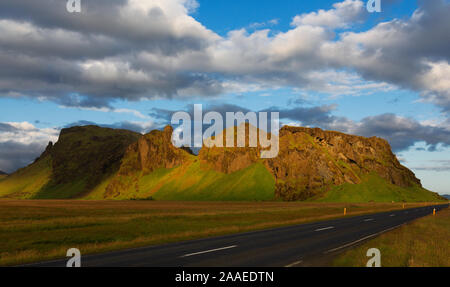 Dramtic clouds over mountain range evening light and Highway 1 Ring Road around Iceland Stock Photo