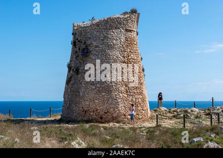 Visitors at Torre Minervino, a sixteenth century coastal watchtower, on Adriatic Coast of Apulia (Puglia), Southern Italy Stock Photo
