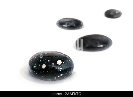 wet beach tumblestones pebbles, on white Stock Photo