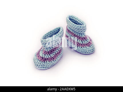 hand knitted baby booties on white Stock Photo