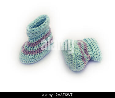 hand knitted baby booties on white Stock Photo