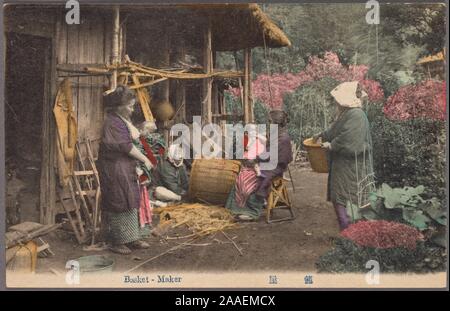 Illustrated postcard of a Japanese basket weaver sitting on the ground outside his shed weaving a basket, with a group of women and children looking on, Japan, 1915. From the New York Public Library. () Stock Photo