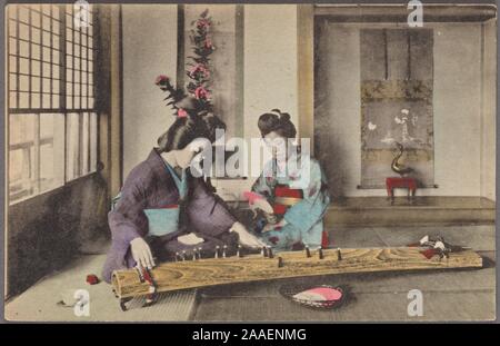 Illustrated postcard of two Japanese women wearing traditional kimono, kneeling on the floor playing the traditional Japanese stringed musical instrument called koto, Japan, 1920. From the New York Public Library. () Stock Photo