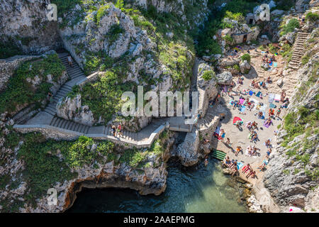 Aerial view of public beach (Il Ciolo) from road bridge at Channel Ciolo near Gagliano del Capo on Adriatic Coast of Apulia (Puglia) in Southern Italy Stock Photo