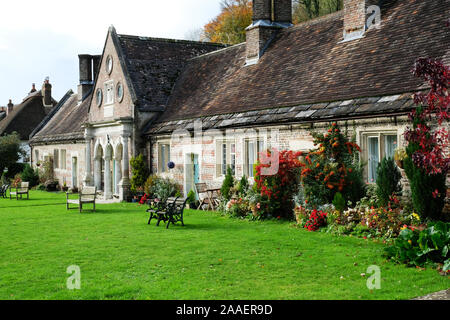 Exterior view of almshouses in Milton Abbas, Dorset, UK - John Gollop Stock Photo