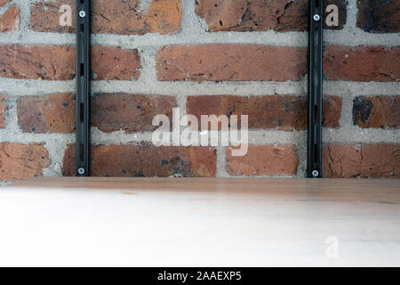 Empty wood shelf on old brick wall background, grunge industrial interior background texture Stock Photo