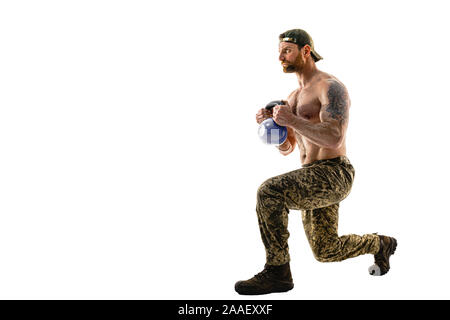 Full size, side view portrait of successful, professional, attractive, concentrated man showing how to make lunges front, back with weight, isolated on white background. Stock Photo