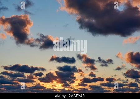 Background of sunset clouds with fiery orange colors Stock Photo