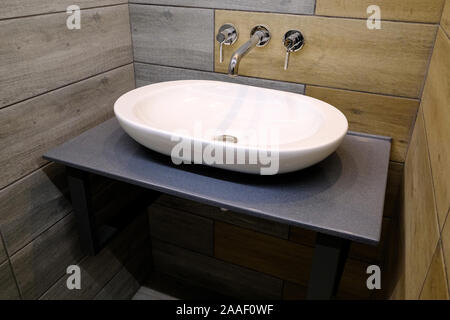 Classic modern white washbasins with chrome water tap and soap dish Stock Photo