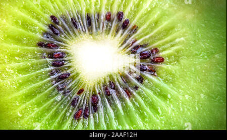Slice of fresh juicy delicious and healthy kiwi fruit, close up Stock Photo
