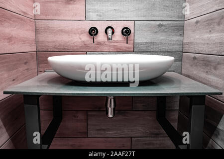 Classic modern white washbasins with chrome water tap and soap dish Stock Photo