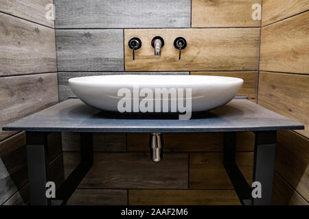 Classic modern white washbasins with chrome water tap and soap dish Stock Photo