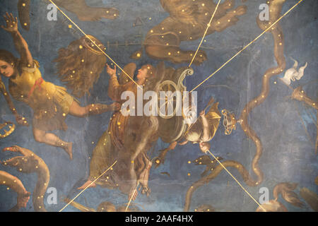A heavenly painting featuring angels on the ceiling of one of the many rooms of Palazzo Ducale in Mantua (Mantova), Italy. Stock Photo