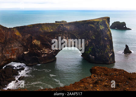 Dyrholaey arch on the coast of Reynisfjara near Vik, Iceland Stock Photo