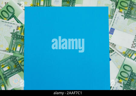 Many Banknotes of 100 Euro with blue copy space, the European currency background flat lay Stock Photo