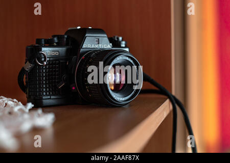 Old SLR Vintage camera Praktica B200 placed on a shelf. Wroclaw, Poland - October 22. 2019: 35mm film made by German company Pentacon between 1983 and Stock Photo