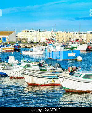 Peniche harbor, fishing boats in row, docks in background, Portugal Stock Photo