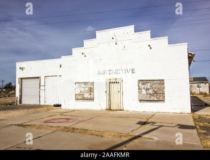 Abandoned Auto Garage With Boarded Up Windows Stock Photo
