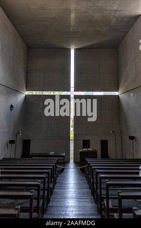 OSAKA, JAPAN - NOVEMBER 11, 2019: Interior of Church of the light - Ibaraki Kasugaoka Church. Designed by Tadao Ando. Stock Photo