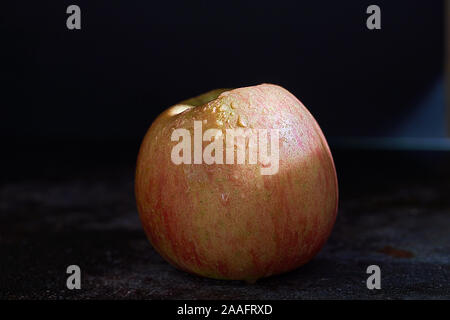 Fuji apple on dark background Stock Photo