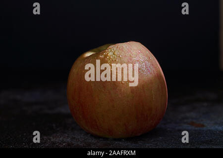 Fuji apple on dark background Stock Photo