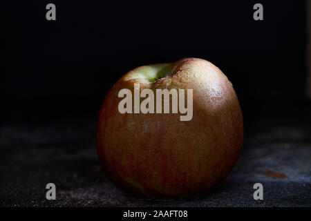 Fuji apple on dark background Stock Photo