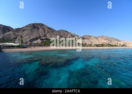 View on coral reef and resort hotels at southern beach of Eilat city aerial view shot from the sea Stock Photo