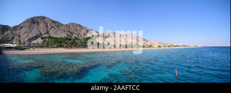 View on coral reef and resort hotels at southern beach of Eilat city aerial view shot from the sea Stock Photo