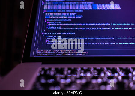 close up laptop computer screen with a programming code creating Stock Photo